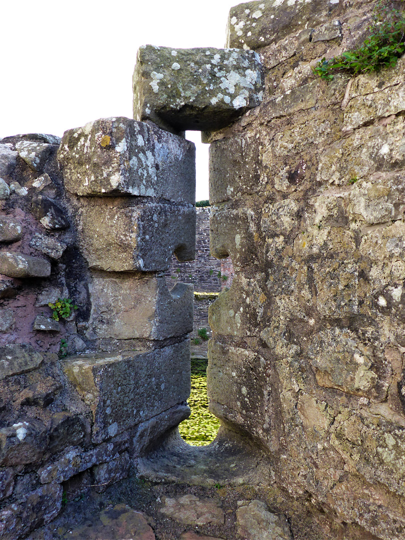 Arrowslit in a damaged wall